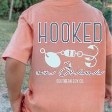 Load image into Gallery viewer, SUNSET Fishing Lure Hooked On Jesus Short Sleeve
